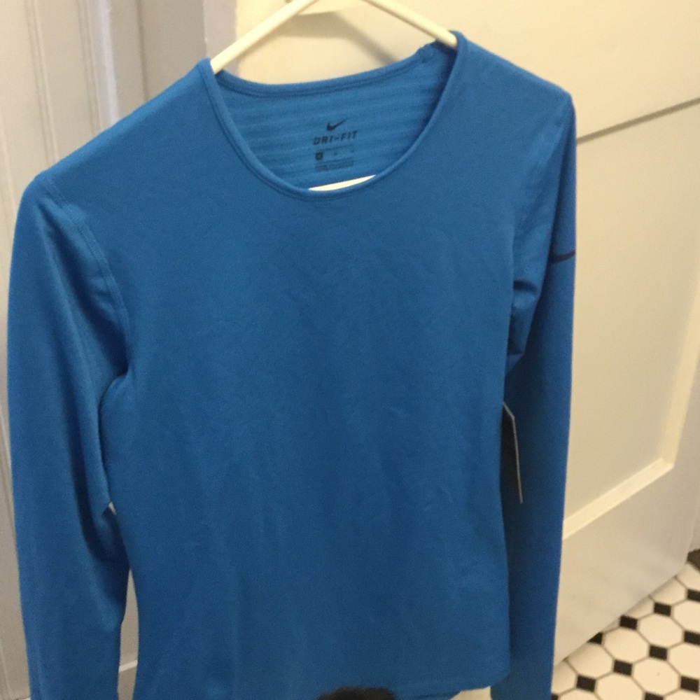 Dri fit nike top.  New still has tag
